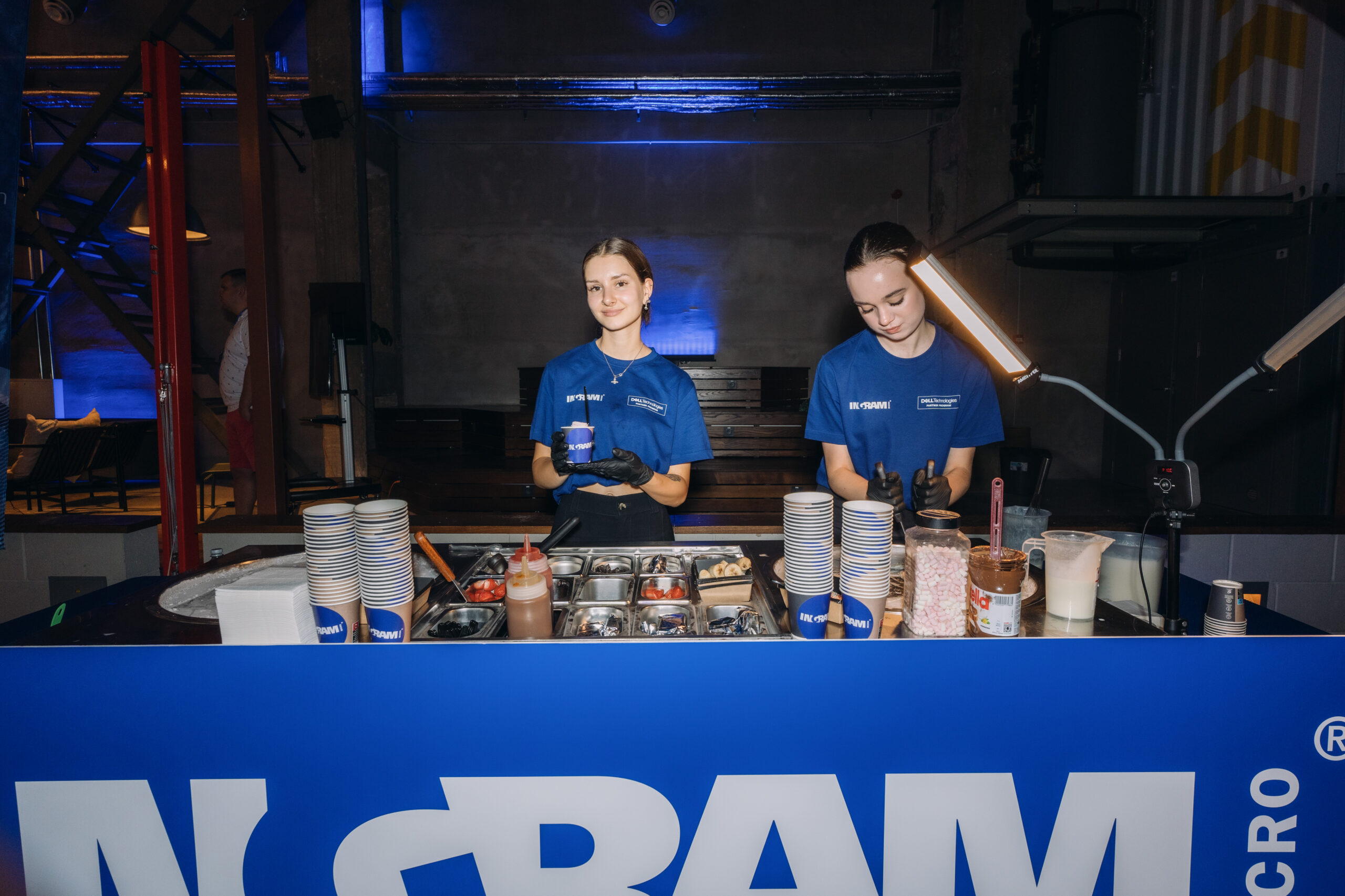 The Loco Rolls team with branded cups at an event