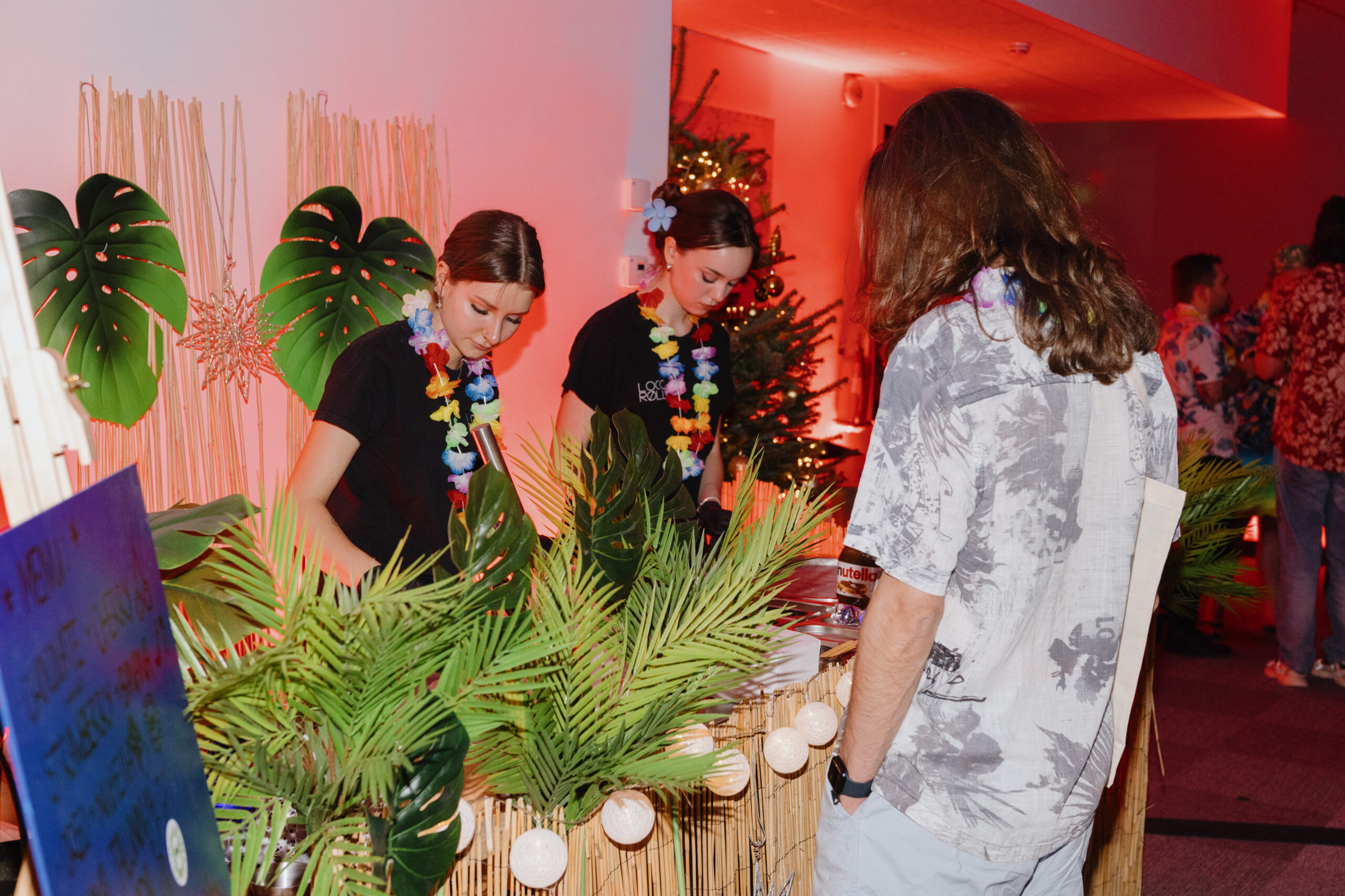 The Loco Rolls team makes ice cream for guests at a themed party